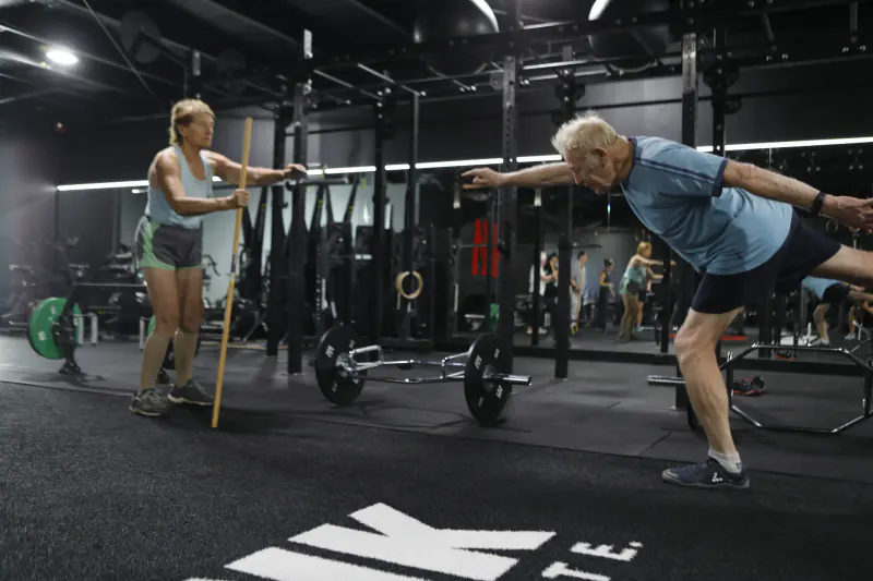 Senior man deadlifting at Iron Monk Fitness