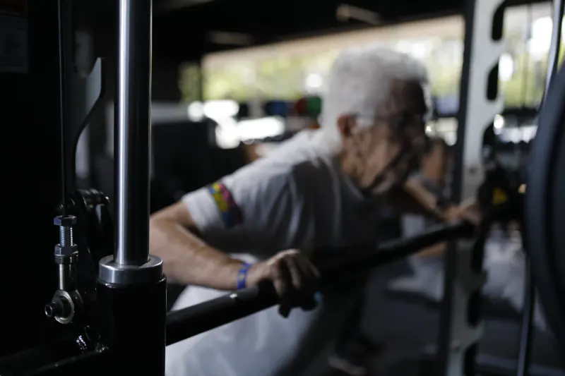 Senior member on cable row machine at Iron Monk